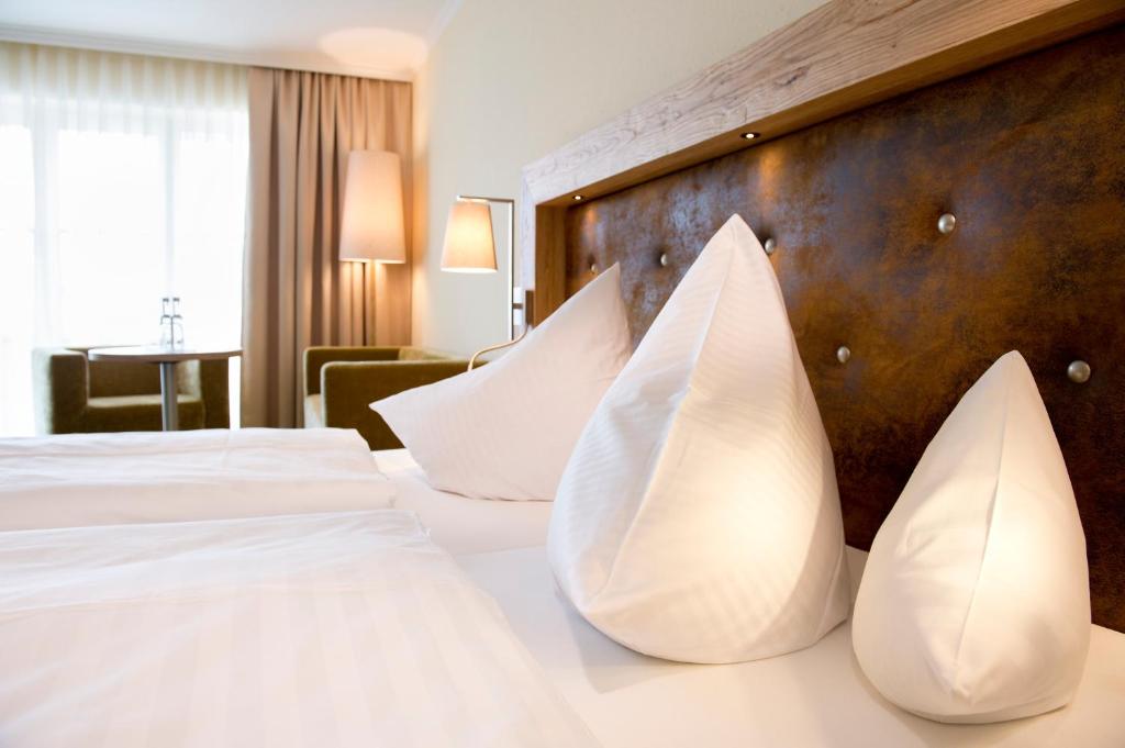 Postel nebo postele na pokoji v ubytování Parkhotel