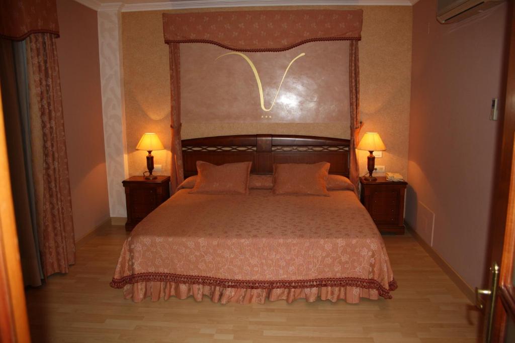 Posteľ alebo postele v izbe v ubytovaní Hotel Acosta Vetonia