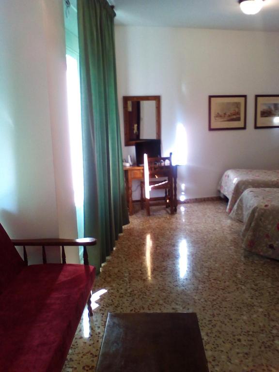Postel nebo postele na pokoji v ubytování Hotel Andalucía