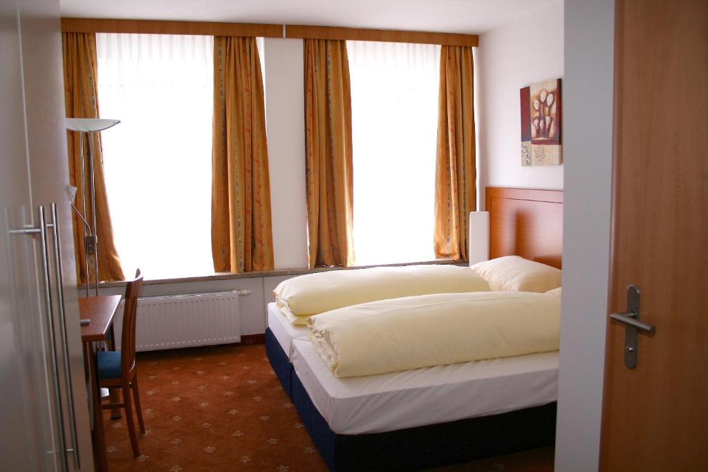 Postel nebo postele na pokoji v ubytování Hotel Evido Salzburg City Center