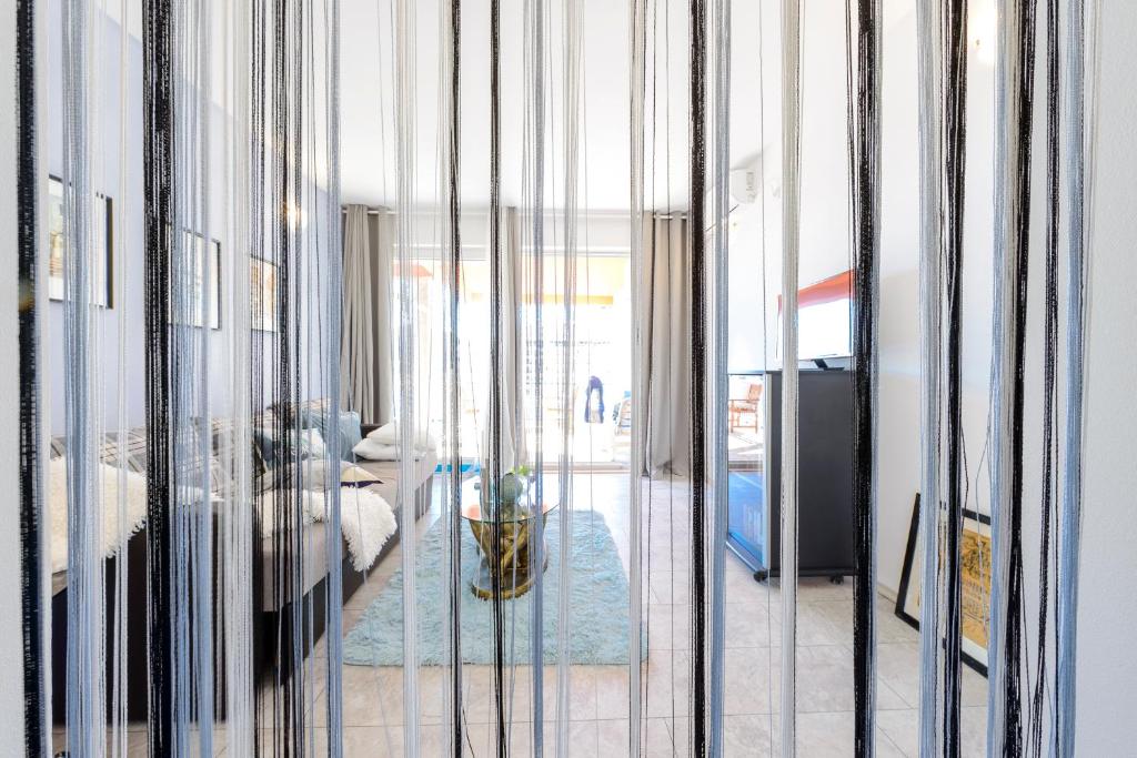 Posteľ alebo postele v izbe v ubytovaní Lorelai Apartments