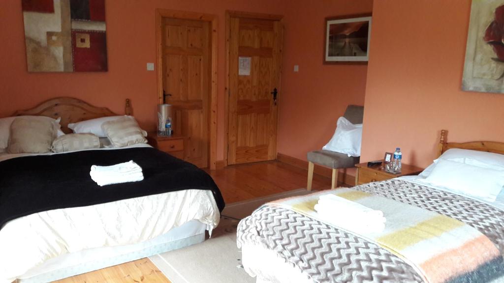 Postel nebo postele na pokoji v ubytování Newlands Lodge