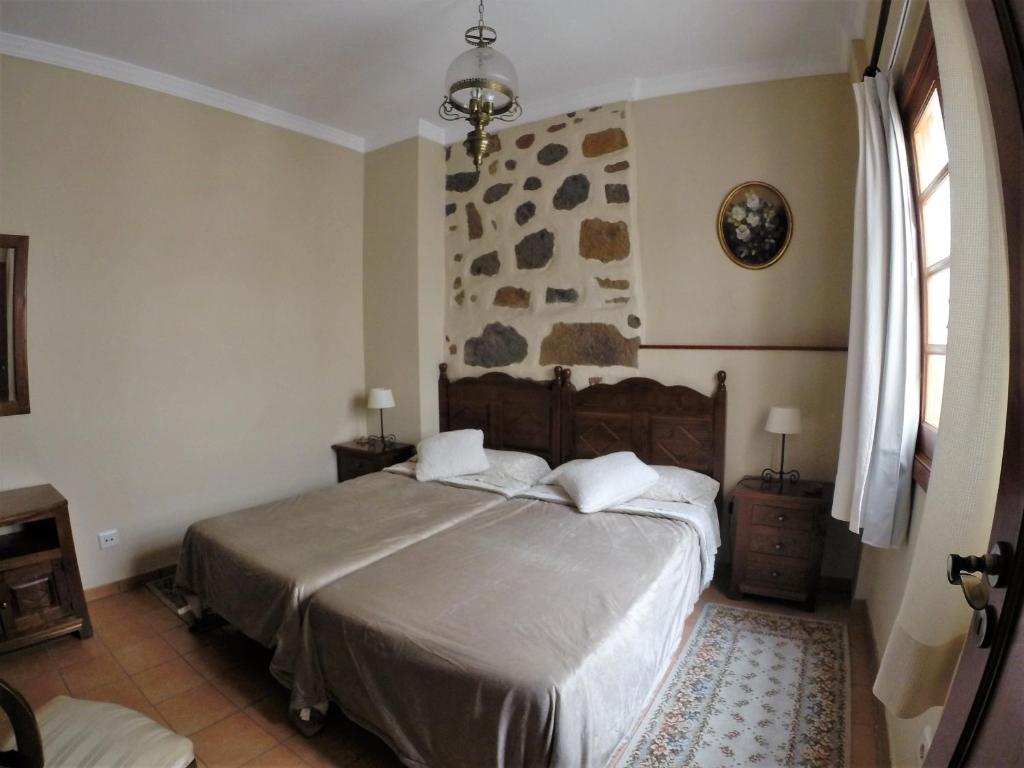 Posteľ alebo postele v izbe v ubytovaní Casa Rural Doña Margarita