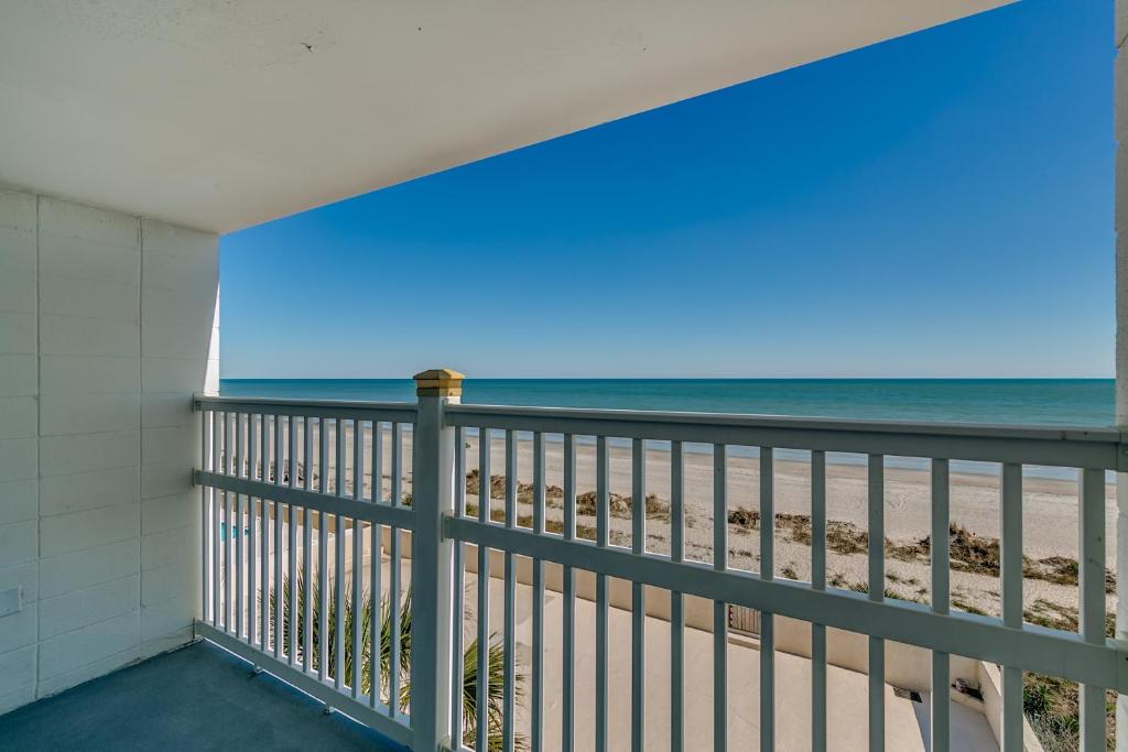a balcony with a view of the beach at Beachcomber Inn & Suites in Myrtle Beach