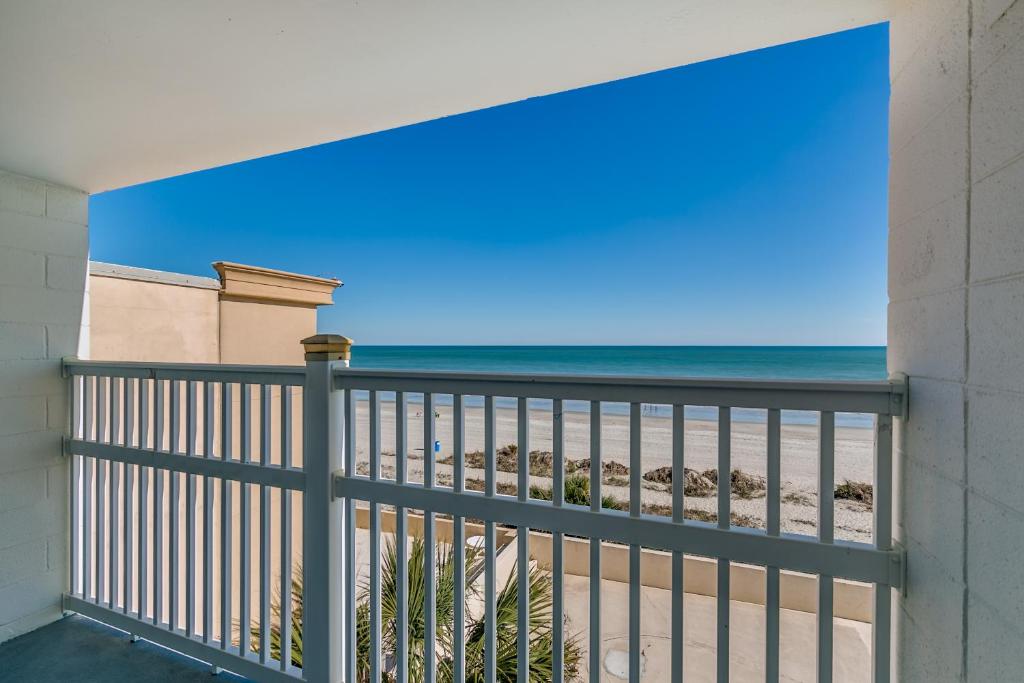 a balcony with a view of the beach at Beachcomber Inn & Suites in Myrtle Beach