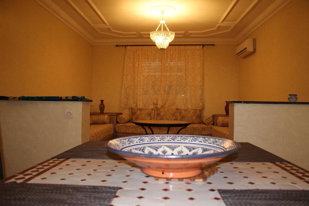 Postel nebo postele na pokoji v ubytování Appart'hotel Dior Lamane