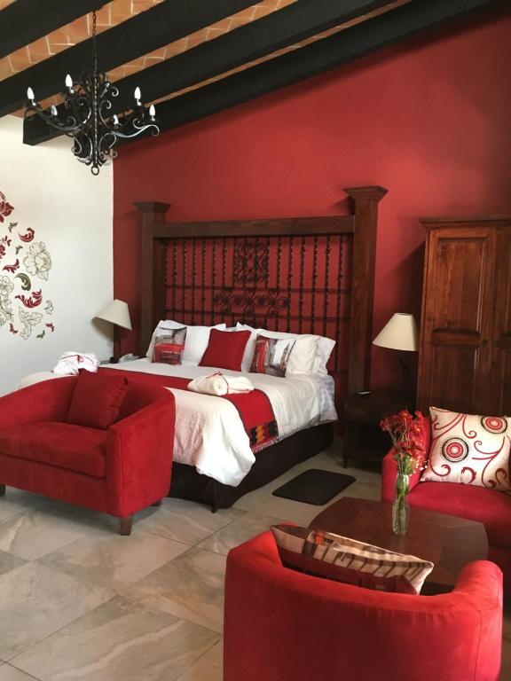 Postel nebo postele na pokoji v ubytování Hotel Casa Don Quijote