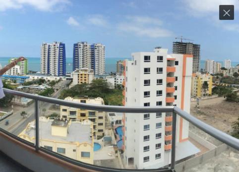 a view of a city from a balcony of a building at Departamento Tonsupa piso 11 in Tonsupa