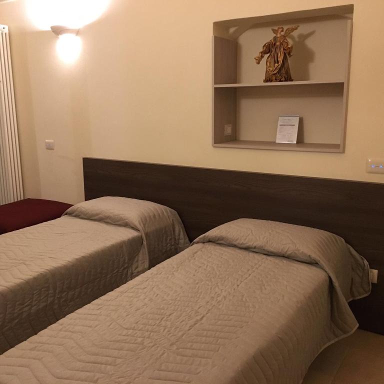 Postel nebo postele na pokoji v ubytování B&B San Potito