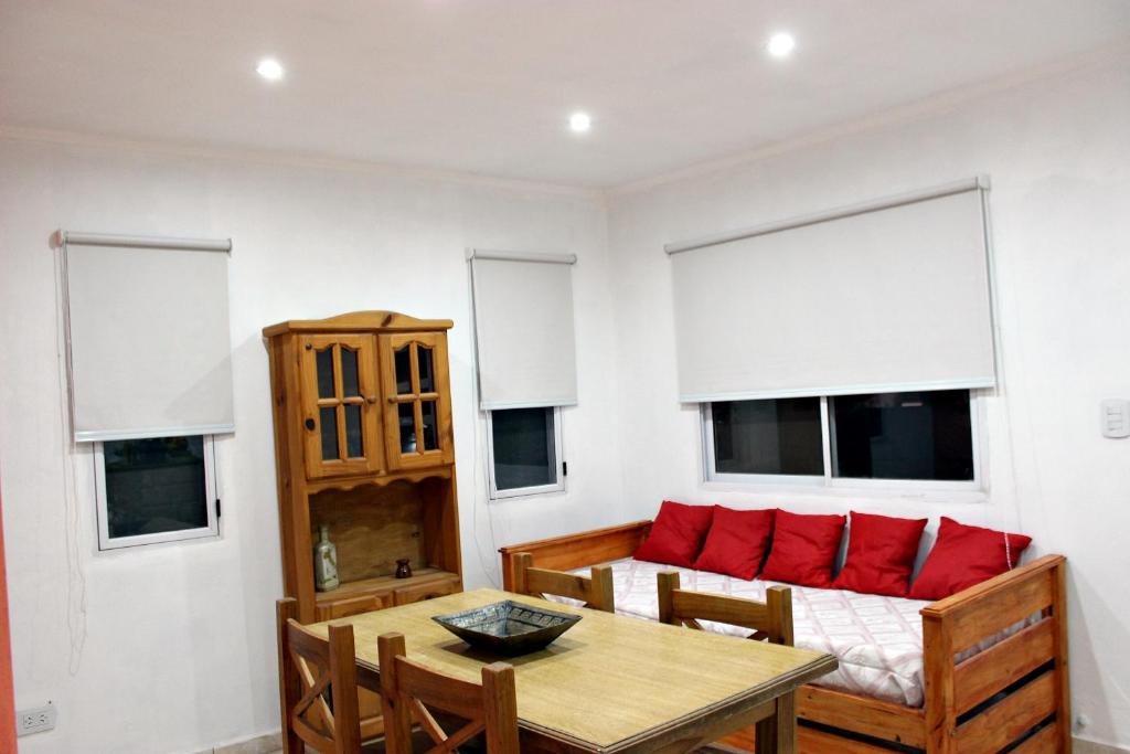 a living room with a couch and a table at Departamento Monte Hermoso in Monte Hermoso