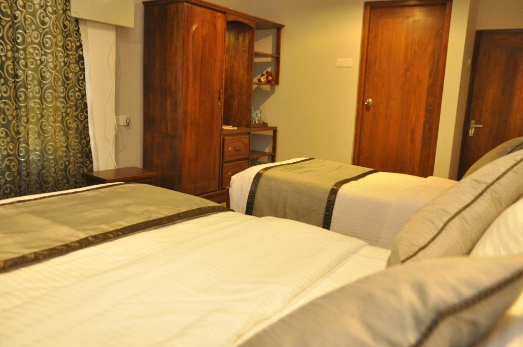 Postel nebo postele na pokoji v ubytování Forest View Lodge