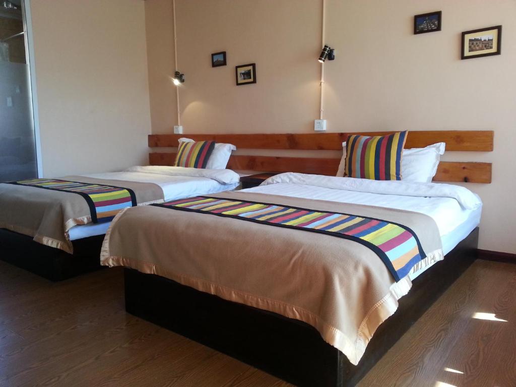 Postel nebo postele na pokoji v ubytování Kevin's Trekker Inn