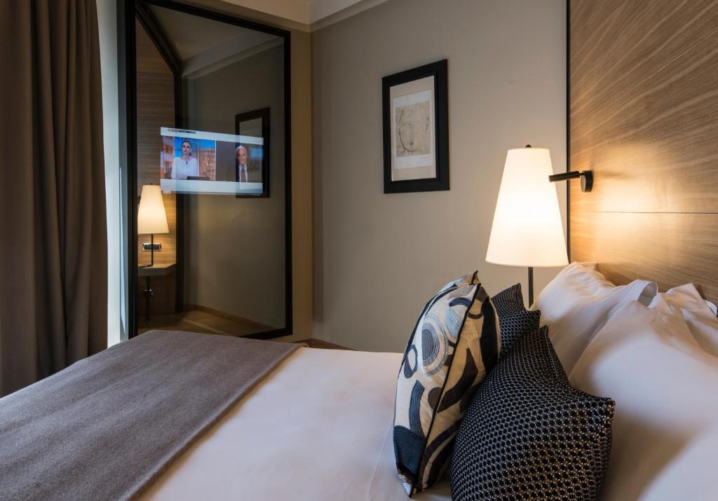 A bed or beds in a room at 47 Boutique Hotel