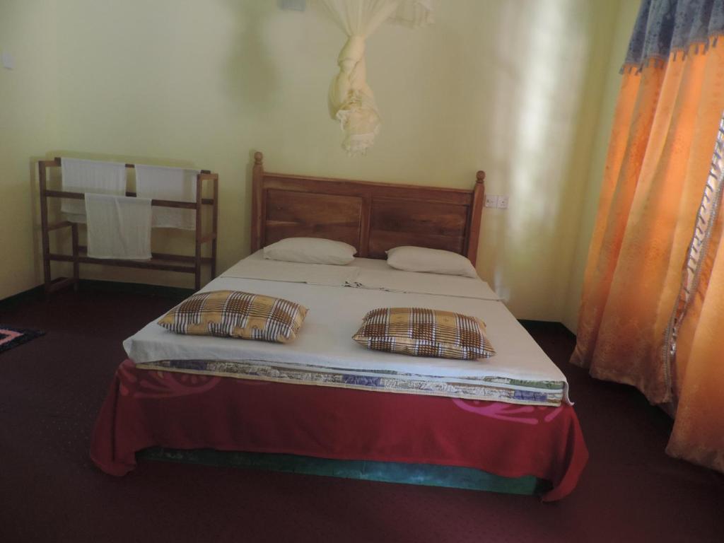 Postel nebo postele na pokoji v ubytování Sigiriya Freedom Lodge