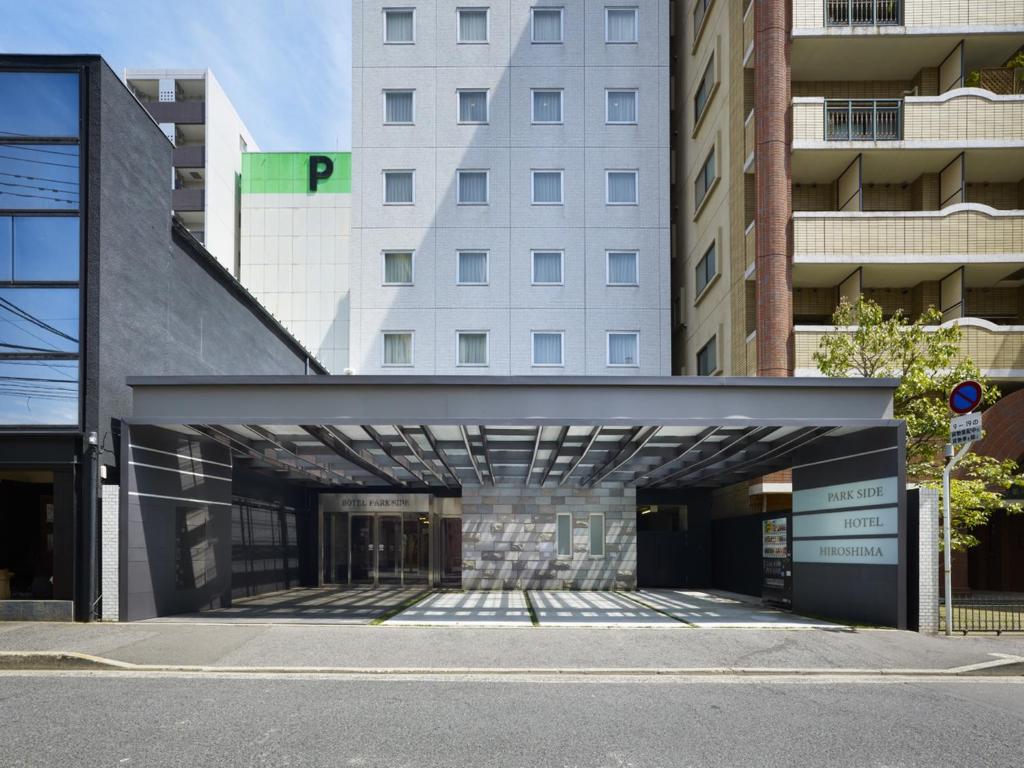 an entrance to a building with a building at Hotel Park Side Hiroshima Peace Park in Hiroshima