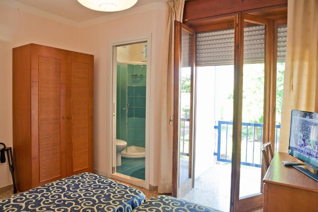 Postel nebo postele na pokoji v ubytování Hotel Horizonte
