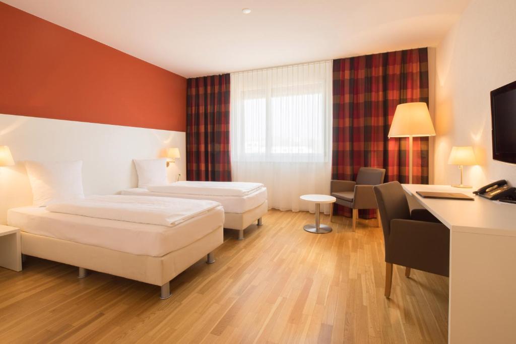 Postel nebo postele na pokoji v ubytování Hotel Arcade