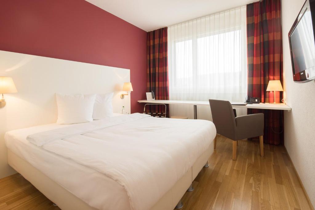 Postel nebo postele na pokoji v ubytování Hotel Arcade