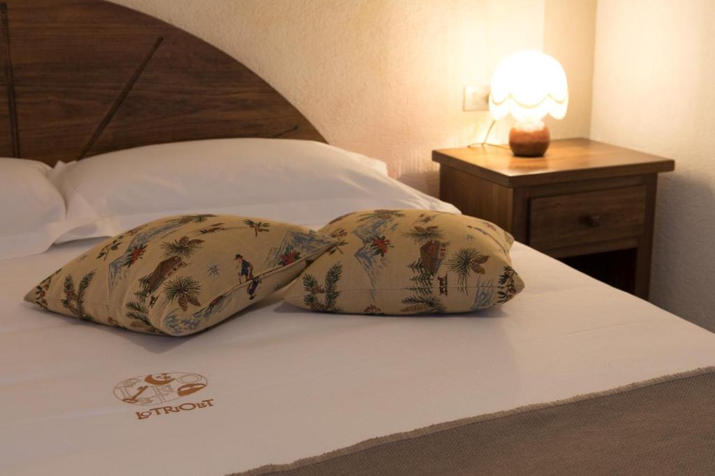 Postel nebo postele na pokoji v ubytování Maison Lo Triolet