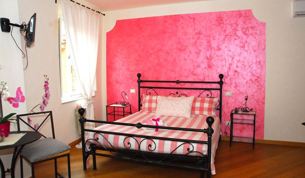 Posteľ alebo postele v izbe v ubytovaní L'Iris B&B