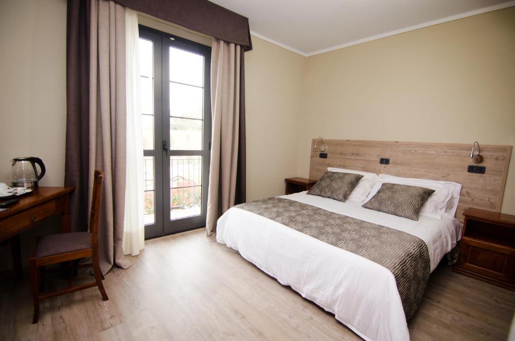 Postel nebo postele na pokoji v ubytování Albergo Ristorante San Biagio