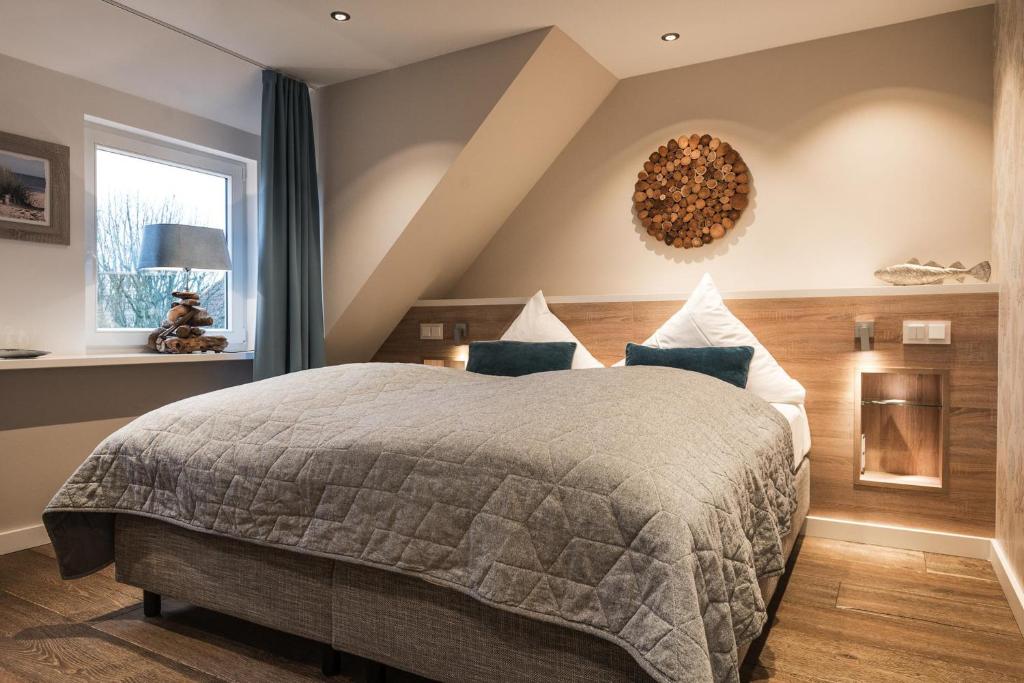 Postel nebo postele na pokoji v ubytování Landhaus Sylter Hahn