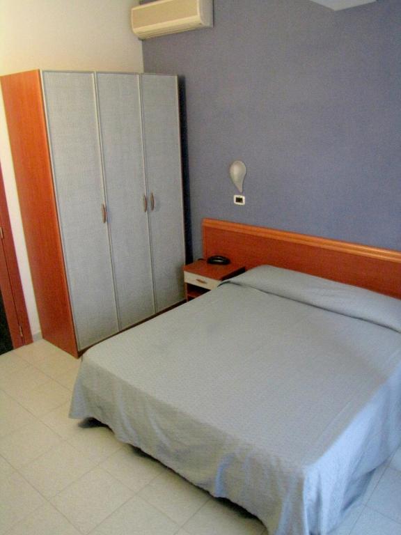 Postel nebo postele na pokoji v ubytování Hotel Acquario