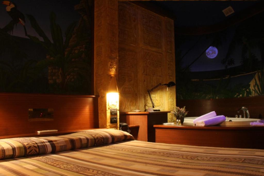 Postel nebo postele na pokoji v ubytování Hotel Motel 2000
