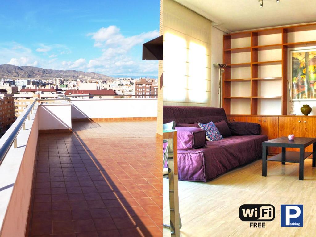 a living room with a purple couch on a balcony at Atico Alhamilla in Almería