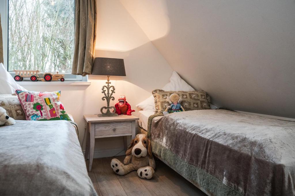 Postel nebo postele na pokoji v ubytování Landhaus Sylter Hahn