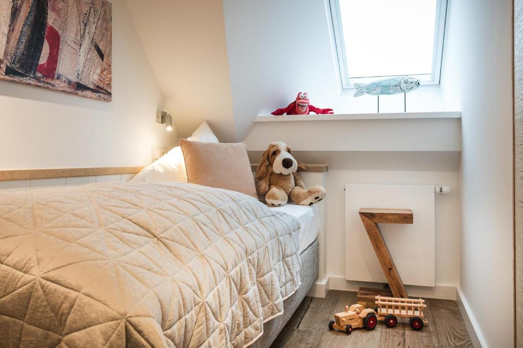 Postel nebo postele na pokoji v ubytování Landhaus Sylter Hahn