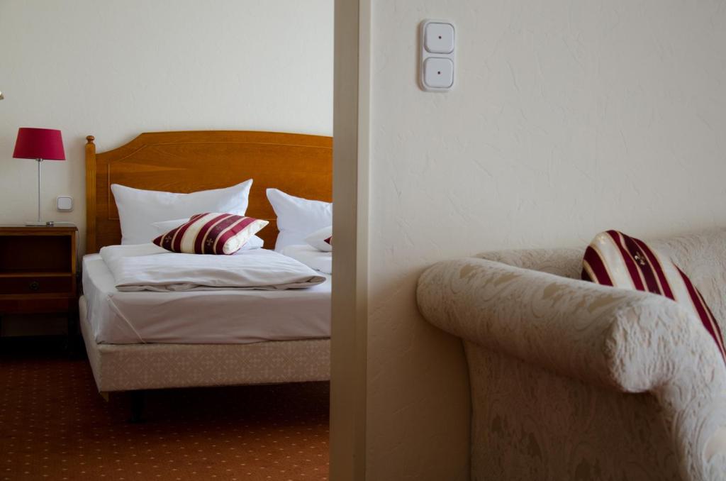 Postel nebo postele na pokoji v ubytování Mercure Hotel Plaza Magdeburg