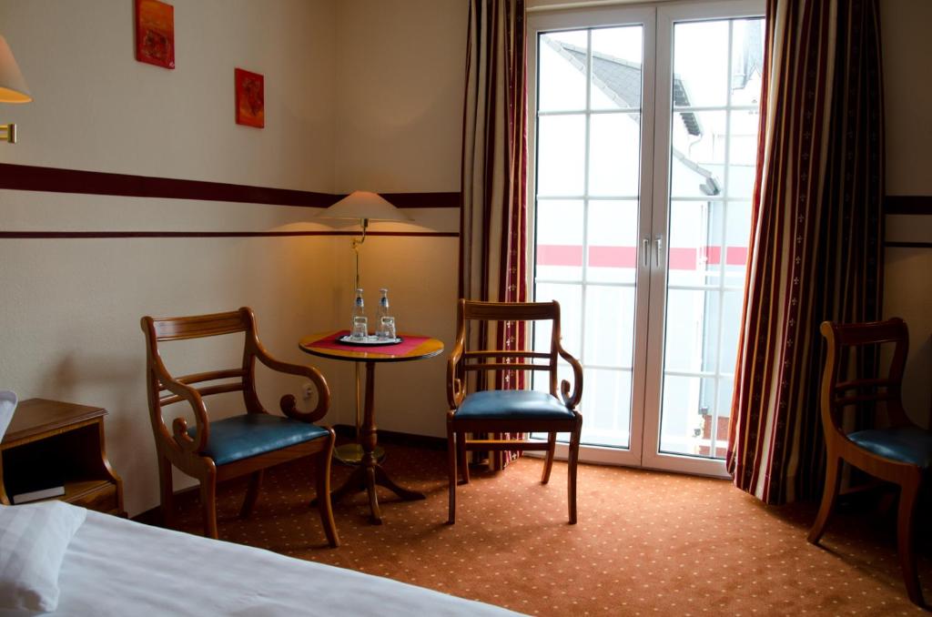 Postel nebo postele na pokoji v ubytování Mercure Hotel Plaza Magdeburg