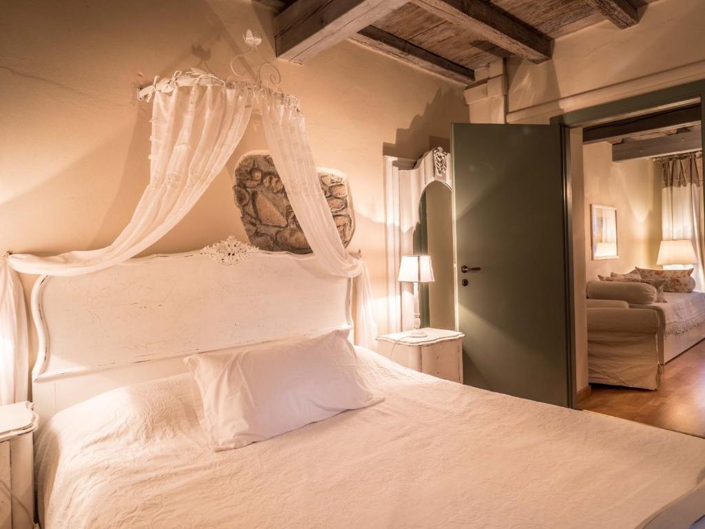 Postel nebo postele na pokoji v ubytování Relais Il Pigno