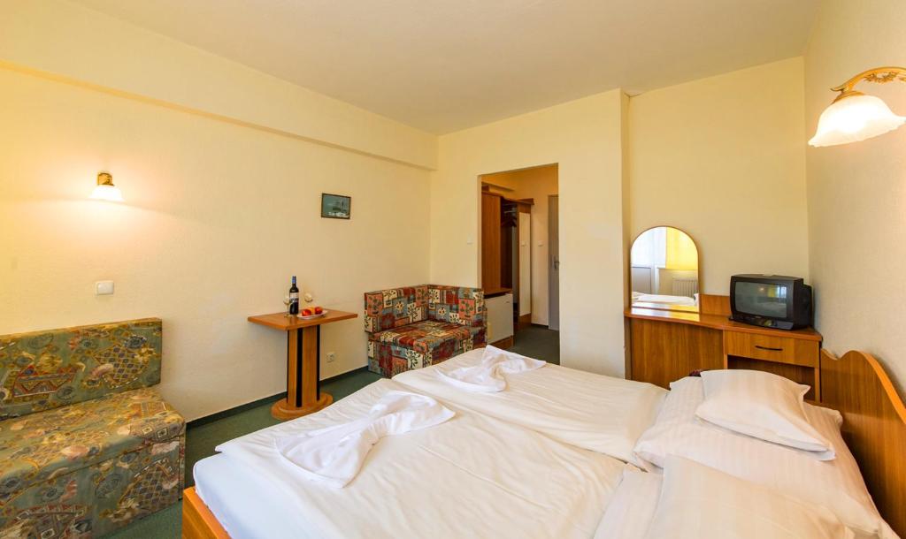 Postel nebo postele na pokoji v ubytování Hotel Nostra