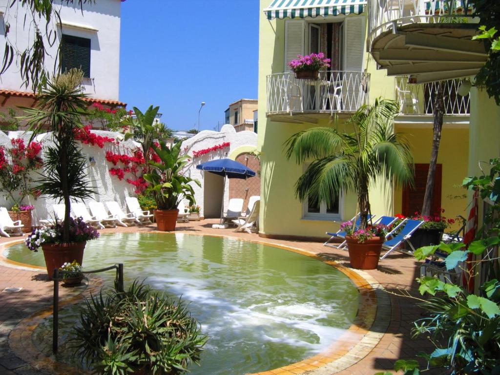 a swimming pool in the middle of a building at Hotel Europa in Ischia