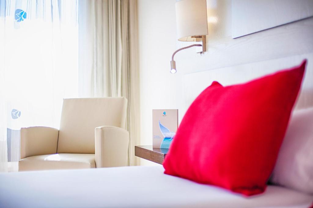 Postel nebo postele na pokoji v ubytování Grupotel Montecarlo
