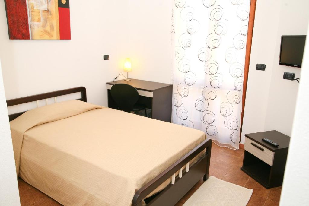 Een bed of bedden in een kamer bij Villa Marogna