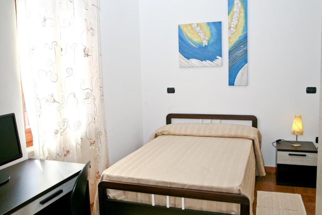 Een bed of bedden in een kamer bij Villa Marogna