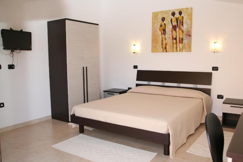 Een bed of bedden in een kamer bij Villa Marogna