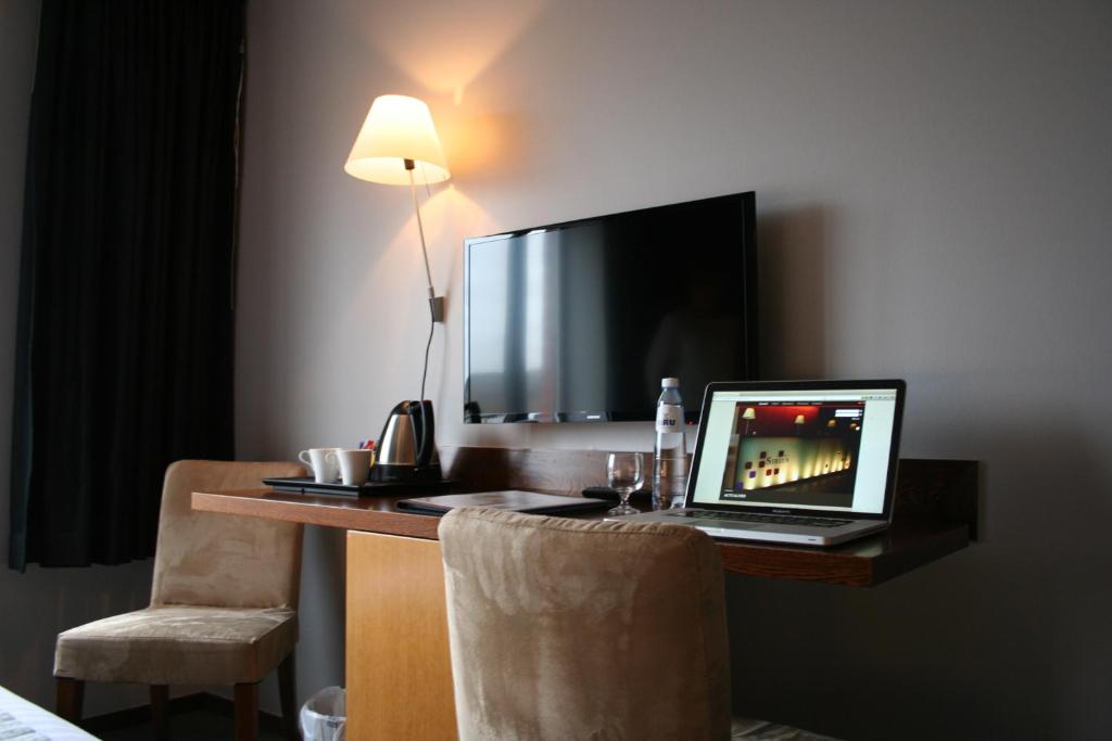 TV a/nebo společenská místnost v ubytování Hotel Sirius