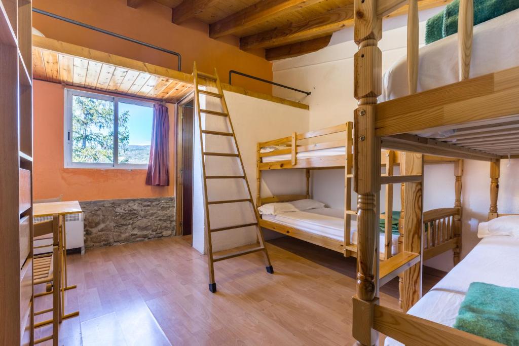 Postel nebo postele na pokoji v ubytování Alberg La Solana