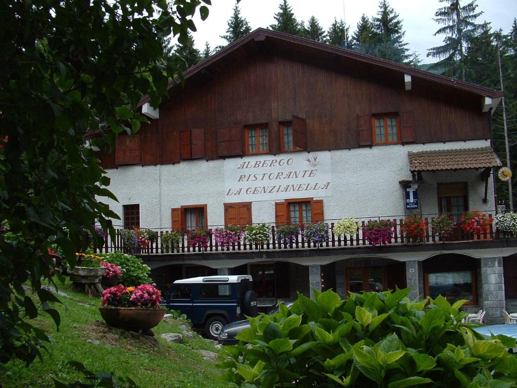 a building with a sign on the side of it at Albergo La Genzianella in Bellagio