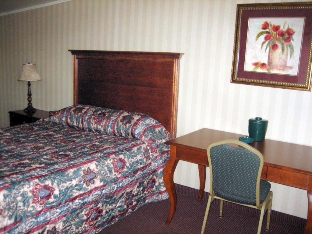 Postel nebo postele na pokoji v ubytování Fair Motel