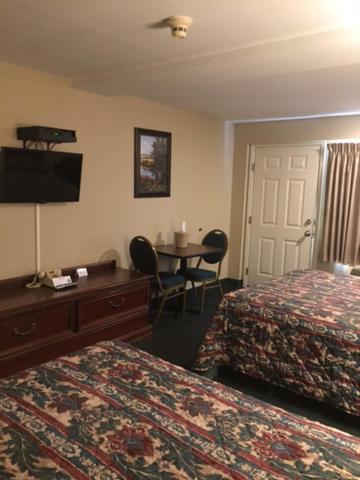 Postel nebo postele na pokoji v ubytování Fair Motel