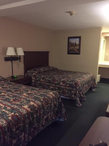 Postel nebo postele na pokoji v ubytování Fair Motel