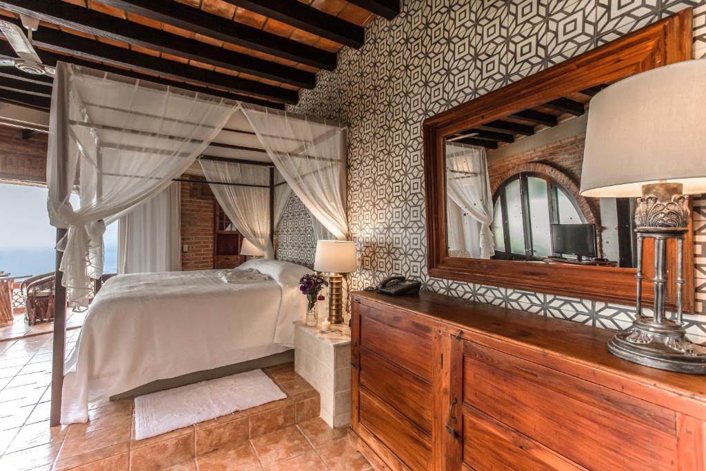Postel nebo postele na pokoji v ubytování Quinta Maria Cortez Beach Hotel