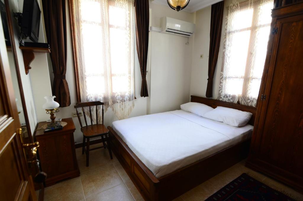 Postel nebo postele na pokoji v ubytování Ayışığı Hotel