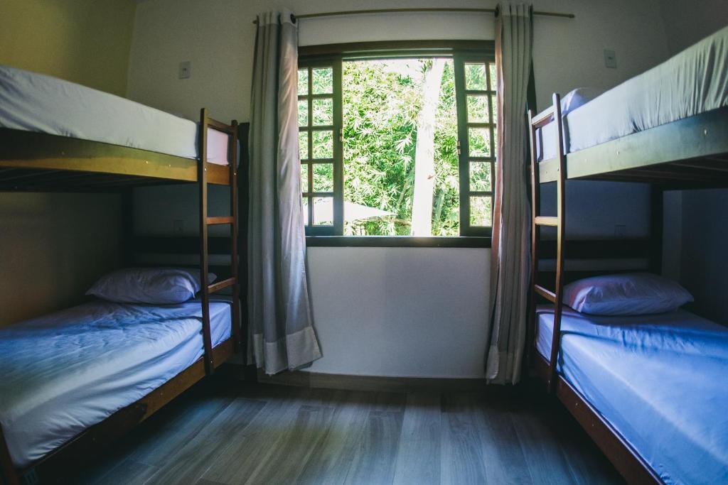 Postel nebo postele na pokoji v ubytování Hostel Refúgio