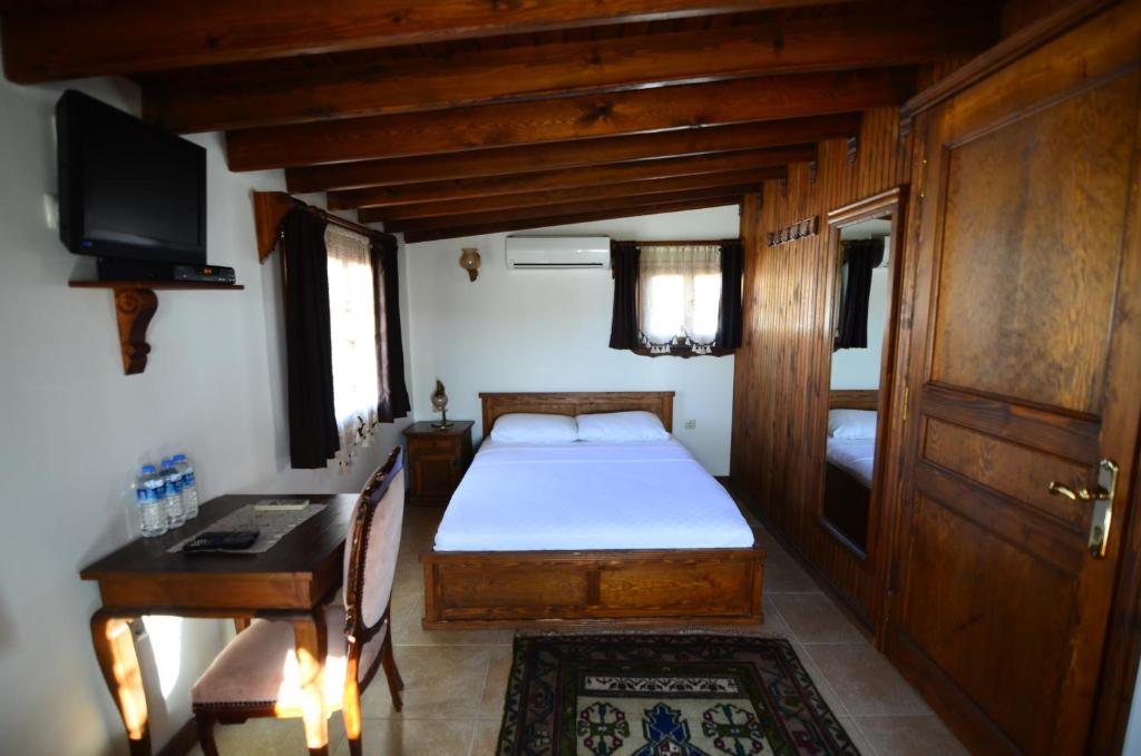 Postel nebo postele na pokoji v ubytování Ayışığı Hotel
